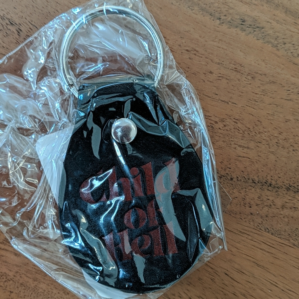 Supreme "child of hell" keychain
